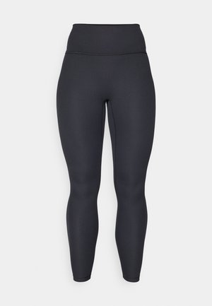 Leggings noires côtelées taille haute avec un design ajusté, une texture lisse et une coupe longue. Dotés d'une ceinture large pour un meilleur maintien.