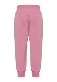 Rosa sweatpants med avslutningar vid anklarna och en ribbad midja, tillverkade av mjukt bomullsmaterial, med en slät textur och enkel design.