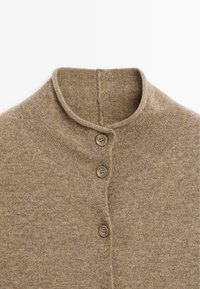 Brown knitted sweater with a high collar, featuring three round buttons and a smooth texture. Simple design without patterns or accents.