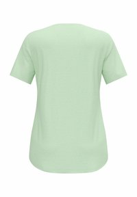 T-shirt à manches courtes, col rond, de couleur vert clair, fabriqué en tissu doux et texturé avec un motif moucheté subtil. Fini lisse à l'ourlet.