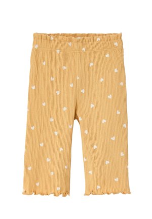 Yellow textured toddler pants with white heart patterns, elastic waistband, and ruffled hems.