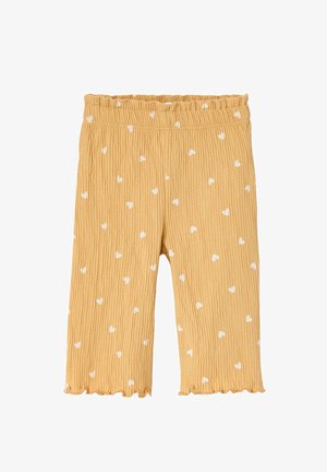 Yellow textured toddler pants with white heart patterns, elastic waistband, and ruffled hems.