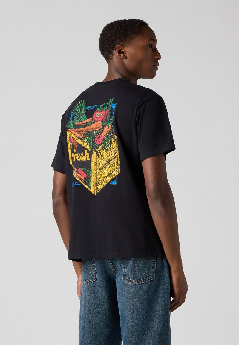 Black cotton t-shirt featuring a colorful graphic of a crate with vegetables and the word "fresh" on the back. Short sleeves, relaxed fit.