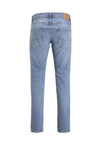 Light blue denim jeans with a straight cut, featuring two back pockets, subtle stitching details, and a brown leather brand patch on the waist.