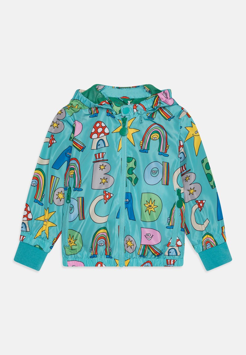 Colorful teal windbreaker jacket with patterns of rainbows, stars, mushrooms, and letters; features a hood, zip closure, and elastic cuffs.