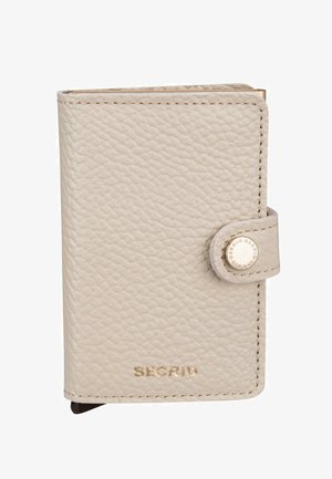Portefeuille en cuir beige avec une finition texturée, doté d'une fermeture pression et d'une quincaillerie dorée. Logo « SECRID » embossé sur le devant.