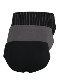 Tre paia di biancheria intima da donna: un paio nero con righe verticali, un paio grigio chiaro uniforme e un paio nero uniforme; realizzati in tessuto morbido ed elastico.
