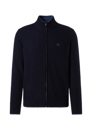 Suéter azul marino con cremallera, hecho de lana tejida, con cuello alto y puños acanalados, con un logo sutil en el pecho y un interior de cuello en contraste.