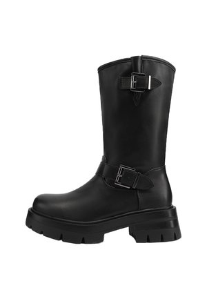 Stivale alla caviglia in pelle nera con suola spessa, fibbie laterali e una finitura liscia. Presenta una punta arrotondata e un design di altezza media sulla polpACC. Stile elegante e versatile.