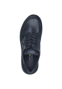 Black sneaker with a textured mesh upper, smooth suede accents, and a zipper closure. Features a cushioned insole with branding.