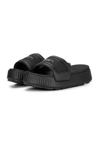 Sandali neri con suola strutturata, ampia cinghia imbottita e dettagli con logo. Realizzati in materiale sintetico, con design piatto.