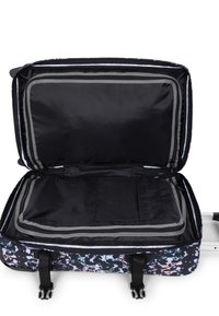 Valigia con rotelle con motivo astratto nero, blu e rosa. Presenta una copertura con cerniera e un interno spazioso con una tasca in rete.