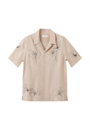 Chemise beige à manches courtes avec boutons, motifs floraux noirs minimalistes en lignes sur le devant, les manches et l'ourlet inférieur.