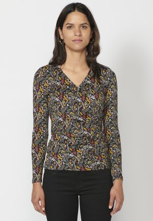 Zwarte lange mouwen top met een V-hals, versierd met een multikleurig bloemmotief in tinten van geel, rood en wit. Strakke pasvorm.