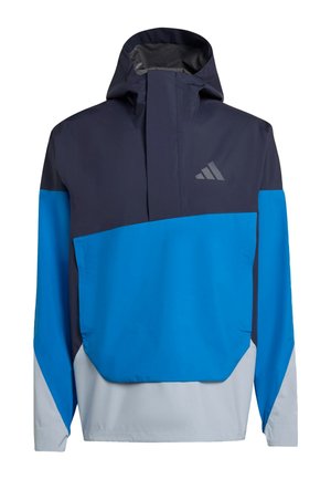 Nylonia oleva hupullinen trikootakki, jossa on väriblokki navyssa, sinisessä ja vaaleanharmaassa; sisältää etutaskun ja logon.