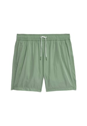 Shorts de bain vert clair avec une taille élastique et un cordon blanc, présentant deux poches latérales et une texture lisse et légère.