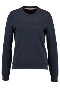 Felpa blu navy realizzata in morbido misto cotone, con colletto e polsini a coste, con "TOMMY" in rilievo sul davanti.