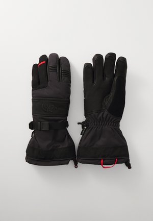 Gants isolés noirs avec une prise texturée, fermetures de poignet élastiques et accents rouges. Fabriqués en matériau imperméable avec des doigts rembourrés.