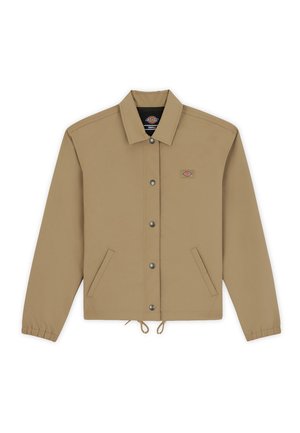 Tan jacket with a button-up front, two side pockets, elastic cuffs, drawstring hem, embroidered logo on the chest, and smooth texture.