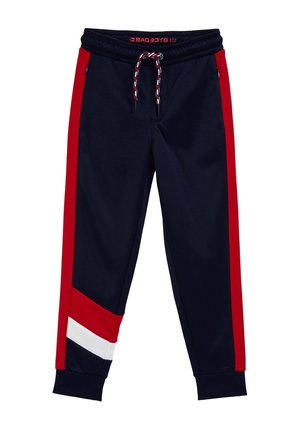 Navyblå joggers med røde sideløb, hvide og røde skrå paneler nær manchetterne, elastisk talje med rød, hvid og sort snøre, lynlåslommer.