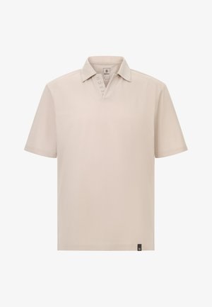Beige Polohemd mit kurzen Ärmeln und Kragen, ausgestattet mit dezentem Markenlogo am Kragen und einem kleinen Logo-Tag am Saum.