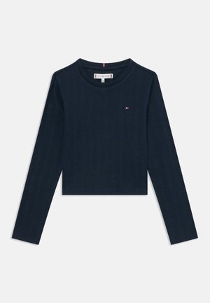 Tmavomodré krátke tričko s dlhým rukávom, okrúhlym výstrihom a malým logom Tommy Hilfiger na ľavej strane hrudníka.