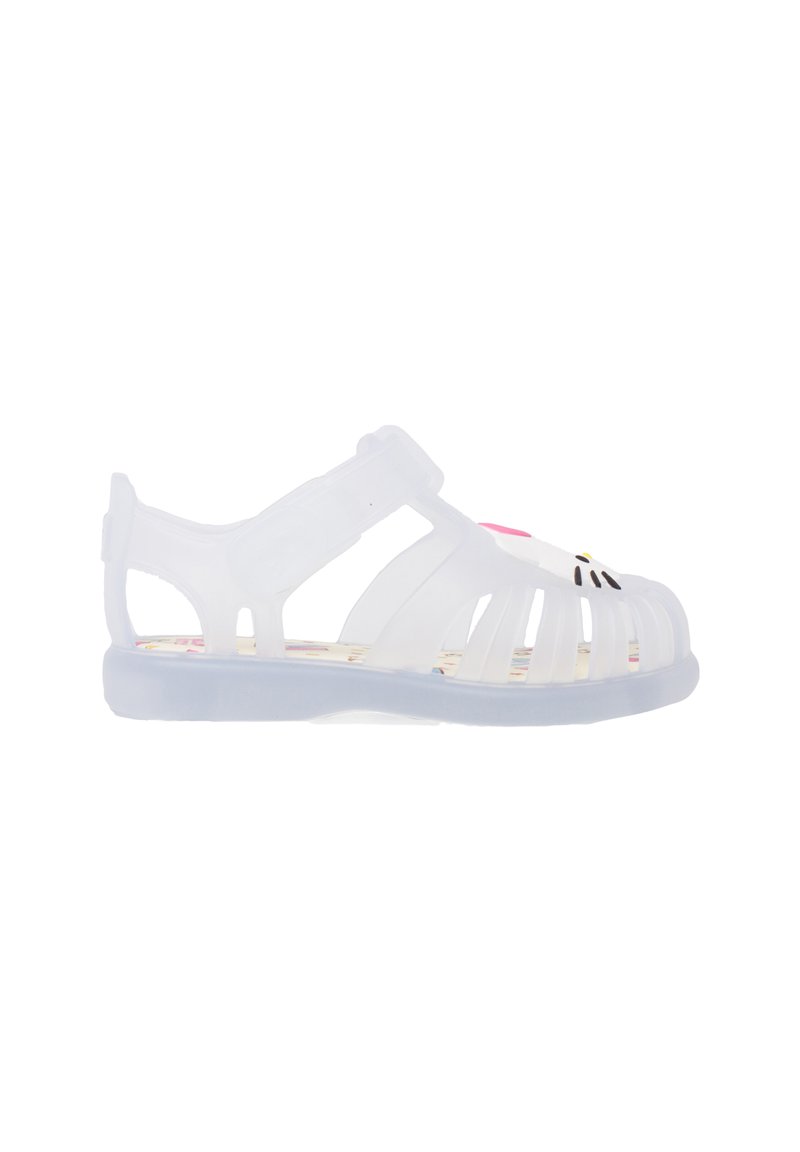 Transparent plastic sandal with cut-out design, adjustable strap, and colorful patterned insole featuring a cartoon character on the toe.