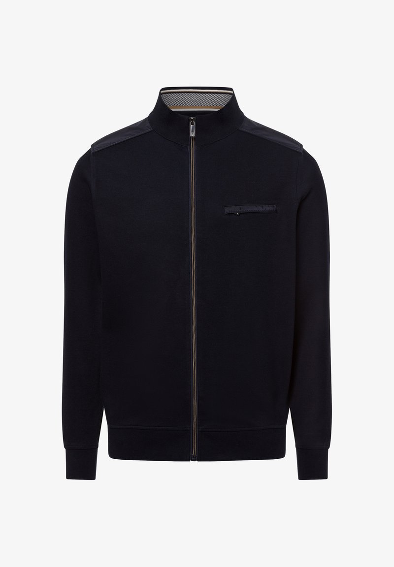 Dunkelblaue Zip-Jacke aus strukturiertem Stoff. Sie verfügt über einen hohen Kragen, Schulterakzente und eine Brusttasche mit Klappe.