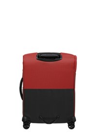 Red and black wheeled suitcase with a textured finish, featuring a top handle, dual wheels, and a contrasting color block design.