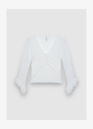 Top bianco a maniche lunghe con scollo a V, dettaglio arricciato al centro e polsini svasati. Realizzato in tessuto strutturato, con un design leggero.