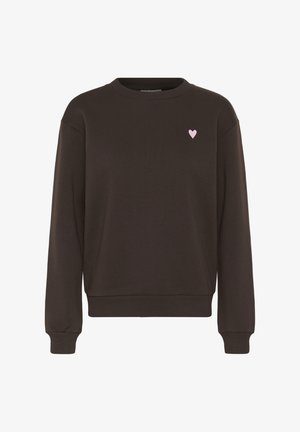 Rudas džemperis su apvalia iškirpte ir ribotu rankogaliu. Kairėje krūtinės pusėje yra mažas rausvas siuvinėtas širdelės motyvas. Minkšta audinio tekstūra.