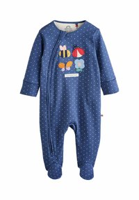 Mörkblå overall med vita prickar, framdragkedja, med fotsydd design, prydd med färgglada broderade insekter och en etikett som säger "hemodlad".