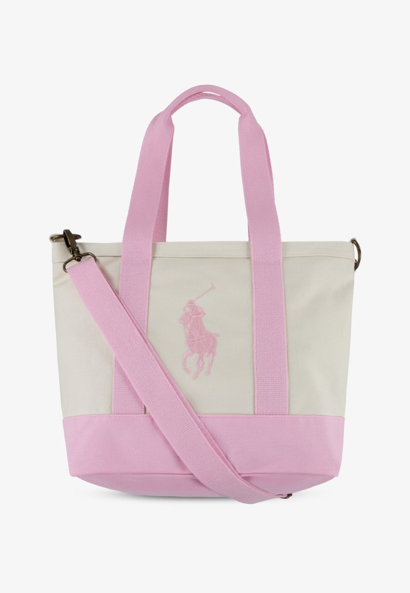 Platnena torba z ročaji, podstavkom in naramnim trakom svetlo roza barve, okrašena z vezenim logotipom igralca polo na smetanastem ozadju.