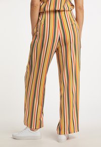 Weite Beine Hose mit einem mehrfarbigen gestreiften Muster in Rosa, Gelb, Grün und marineblau, gefertigt aus glattem Stoff und mit einem elastischen Bund.