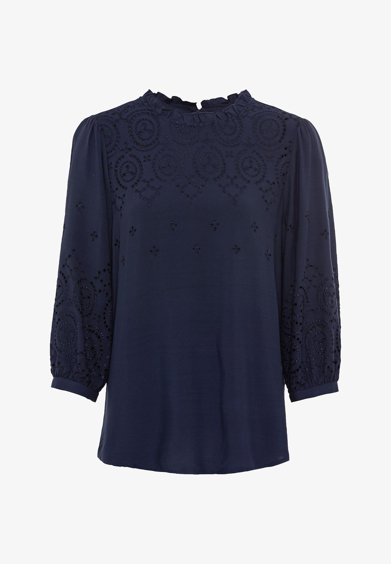 Blusa blu navy con scollatura arricciata e dettagli ricamati in motivi floreali e circolari. Maniche lunghe a sbuffo con polsini arricciati.