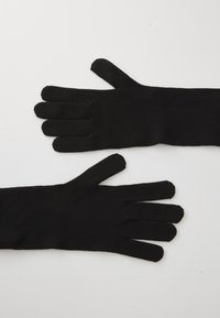 Svarte hansker laget av strikket materiale, med fem fingre og tommel-design, jevn tekstur, og ingen ekstra dekorative elementer.