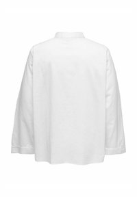 Camicia bianca con colletto posteriore, vestibilità ampia, maniche lunghe e tessuto testurizzato. L'orlo è leggermente curvato, offrendo una silhouette rilassata.