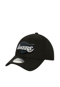 Black cap with a curved brim, featuring an embroidered "LAKERS" logo in white and gray on the front. Made from soft fabric, adjustable size.