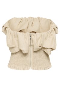 Bež crop top od teksturiranog materijala s volanima na dekolteu, nabrano tijelo i zatvaranje s prednjim patentnim zatvaračem. Detalj lepršavog rubnog dijela.