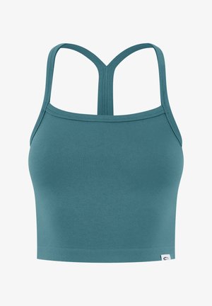 Tyrkisblå sports-bh med tynde dobbelte stropper, der danner en Y-form på ryggen og et lille logo-tag i den nederste kant.