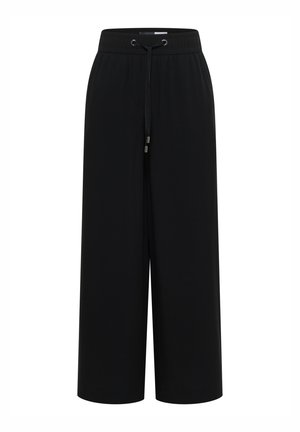 Černé široké kalhoty s elastickým pasem a šňůrkou, bez viditelných vzorů nebo ozdob, zobrazené na bílém pozadí.