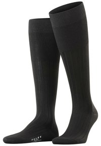 Calze nere al ginocchio con texture a coste, punta rinforzata e branding discreto sulla suola. Realizzate in un materiale morbido e elasticizzato.