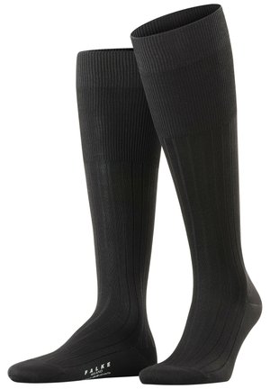 Schwarze knielange Socken mit gerippter Textur, verstärkter Zehenpartie und dezentem Branding an der Sohle. Hergestellt aus einem glatten, dehnbaren Material.