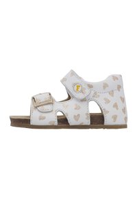 Sandalo bianco con motivo a cuore dorato, fibbia regolabile e cinturino in Velcro. Design open-toe, soletta testurizzata e suola marrone.
