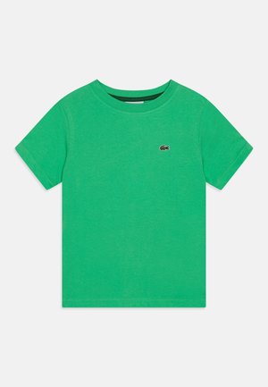 Jednokolorowy zielony T-shirt z krótkim rękawem i okrągłym dekoltem, z małym wyszywanym logo krokodyla na lewej piersi.