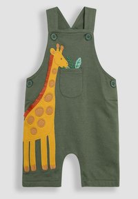Des salopettes en coton vert ornées d'une broderie de girafe jaune avec des accents marron et un détail en forme de feuille. Deux boutons sur les bretelles. Jambes courtes.