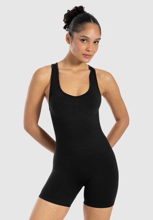 Combinaison noire sans couture avec décolleté arrondi, design sans manches et short ajusté. Tissu lisse et stretch pour un confort optimal.
