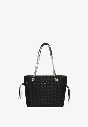 Black quilted tote bag with silver chain and leather handles, featuring a triangular logo plaque and adjustable side drawstrings.