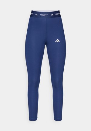 Leggings atléticas azul-marinho feitos de material elástico, com cintura alta com a marca "TECHFIT" e um destaque de logótipo branco.