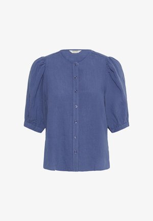 Sinised lühikeste varrukatega pluusid, millel on paksud varrukad ja ees nööpidega sulgemine, esindab ümmargust kaelust ja kerget kangast.